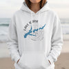 White hoodie with a blue Lake Icaria map and compass graphic.