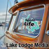 Spoon Life sticker on a boat window, with Lake Lodge Media logo.
