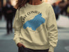 Light yellow sweatshirt with a blue Lake Quinault graphic and compass rose.