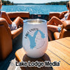 A white stemless wine tumbler with Lake Union Washington printed on it sits on a boat table.