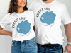 White t-shirts with Crater Lake, Oregon graphic and compass detail.