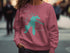 Teal Lake Dillon, Colorado graphic on a dusty rose sweatshirt.