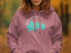 Pink hoodie with Walden Pond Massachusetts graphic and compass rose detail.