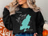 Black sweatshirt with teal Lake Tiorati, New York map design.