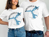 White t-shirts with Nantahala Lake map graphic and compass design.