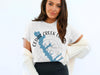 White t-shirt with Cedar Creek Lake map and compass graphic, Texas outlined.