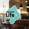 Teal sticker with "Istokpoga Life" in black text on a window.