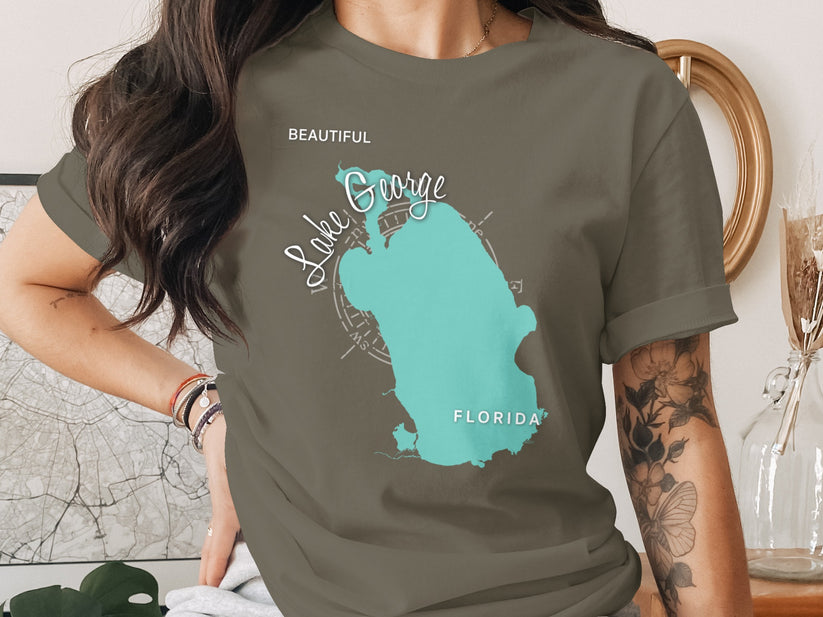 T-shirt with a teal map outline of Lake Okeechobee, Florida.