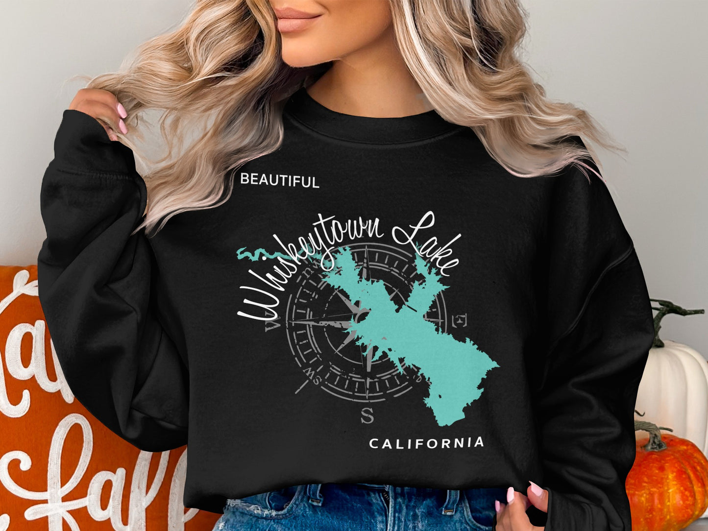 Black sweatshirt with "Whiskeytown Lake" map and compass graphic.