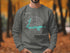 Grey sweatshirt with "Beautiful Lake Ossawinamakee Minnesota" text and compass.