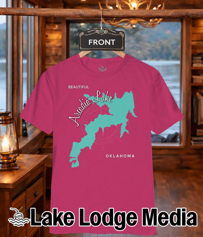 Pink t-shirt with teal Arcadia Lake outline and compass rose, "Oklahoma" text.