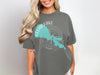 Woman wearing gray t-shirt with Clear Lake California graphic and compass