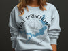 Light blue sweatshirt with Lake Springfield Missouri map and compass design.