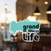 Sticker with teal background and text "grand St. Marys Life" and a copyright line.