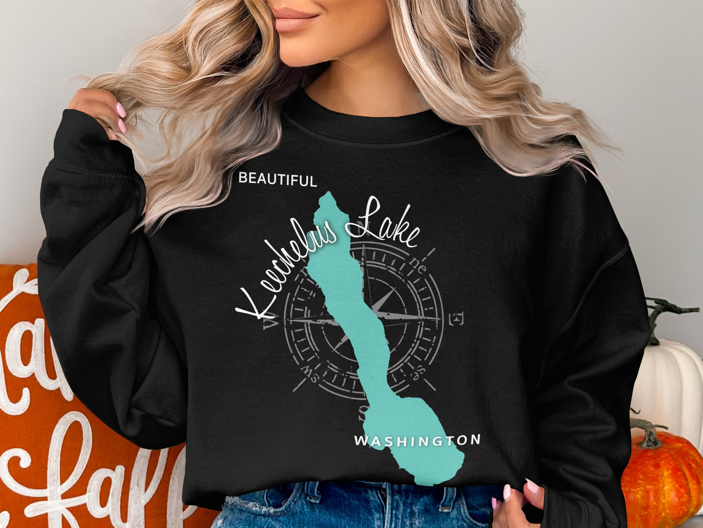 Black sweatshirt with turquoise Lake Chelan map and compass graphic.