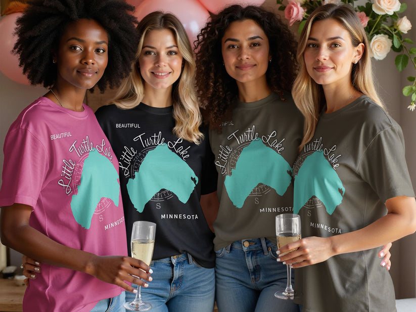Four women wear t-shirts with a teal outline of Minnesota and "Little Turtle Lake Minnesota".