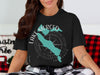 Black t-shirt with "Lake Merced California" text and silhouette over a compass rose graphic.