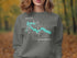 Grey sweatshirt with a compass and Alder Lake, Washington graphic.