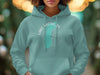 Teal hoodie with Lake Michigan and compass graphic on chest