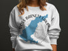 White sweatshirt with blue map of Ross Barnett Lake, Mississippi, and compass graphic.