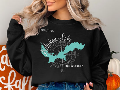 Black sweatshirt with a turquoise map of Ashokan Lake and compass rose.