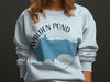 Sweatshirt with Walden Pond Massachusetts map and compass graphic.