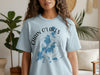 Light blue t-shirt with Chain O' Lakes Illinois map and compass graphic.