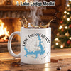 White mug with Lake Thunderbird map and compass design, hot coffee splash.