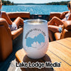 A white insulated wine tumbler with a Diamond Valley Lake California graphic rests on a wooden boat table.