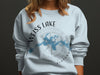 Light blue sweatshirt with "Weiss Lake Alabama" and a compass rose map design.