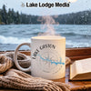 White mug with Lake Gaston Virginia compass design, steaming hot on a wooden surface.