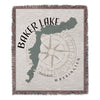 Baker Lake Washington map with compass rose on woven blanket with fringe.