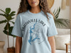 Light blue t-shirt with "Smithville Lake Missouri" text and lake map graphic.
