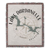 Woven throw blanket with "Lake Dardanelle Arkansas" text and compass rose design.