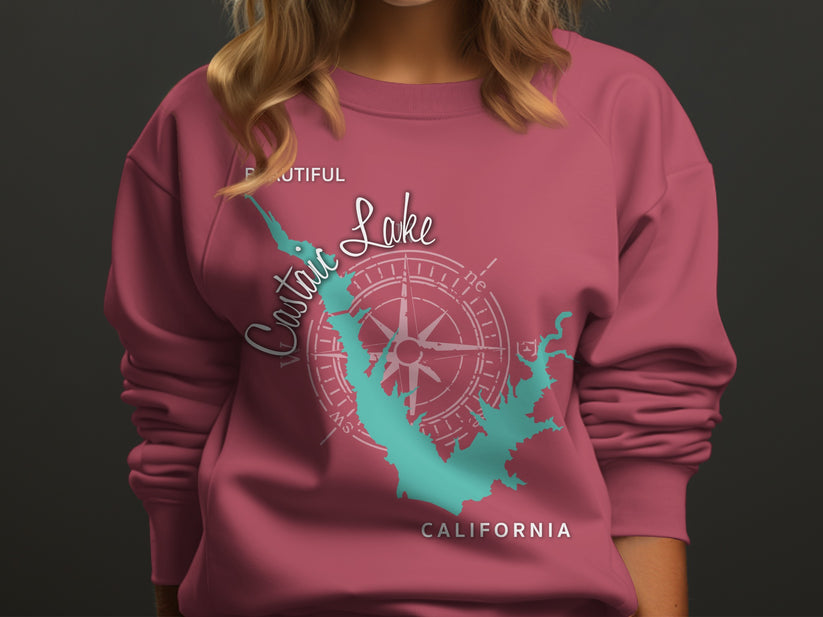 Pink sweatshirt with a teal compass and Castaic Lake, California map graphic.