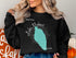 Black sweatshirt with "Beautiful Lake Mohave Arizona" map graphic.