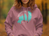Pink hoodie with Mendenhall Lake Alaska map graphic and text.