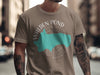 Taupe t-shirt with Walden Pond Massachusetts, compass, and map graphic.