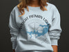 Light blue sweatshirt with Wright Patman Lake and compass graphic, Texas.