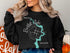 Black sweatshirt with a compass and map design for Bartlett Lake, Arizona.