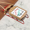 Sled ornament with "Merry Christmas from Douglas Lake" and a turquoise lake map design.