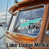 Teal Lake Erie graphic and text on a boat window, "Lake Erie Life" and "Lake Lodge Media".