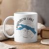 White mug with Rainbow Lake design featuring a blue lake map and compass graphic.
