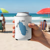 White can cooler with blue Black Lake map and compass, held on a beach.