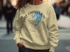 Light yellow sweatshirt with Lake Charleston Ontario map and compass graphic.
