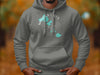 Gray hoodie featuring "Madison Lakes Wisconsin" text with lake shapes and compass design.