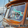 Charlevoix Life sticker on boat window with Lake Lodge Media logo.