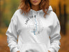White hoodie with Lake Oahe, North Dakota compass graphic and blue water outline.