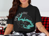 Black t-shirt with Spoon Lake map and compass design, Illinois text.