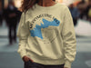 Merrymeeting Lake New Hampshire graphic on a cream crewneck sweatshirt.